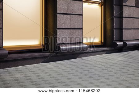 empty show window of shop, city street at night