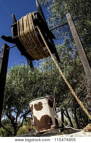 Rusty bucket on the village
