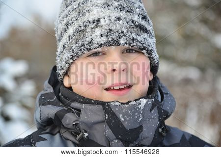 Portrait of frozen boy in winter