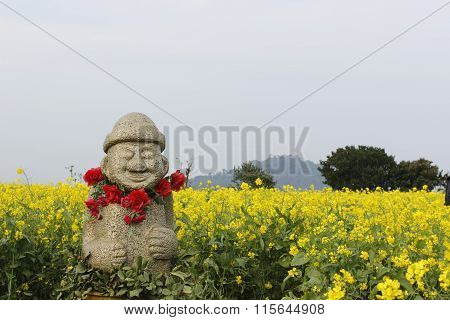 Hareubang Gold Stone Statue With Yellow  In Jeju Island Korea