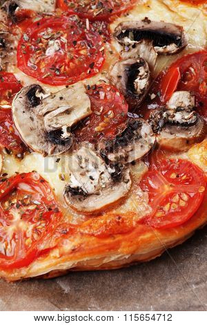 Puff pastry funghi pizza with mushrooms, tomato and cheese