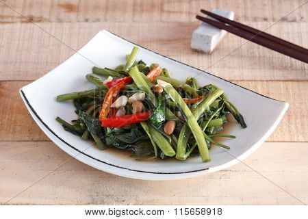 Thai Food Stir Fried Water Spinachon White Plate