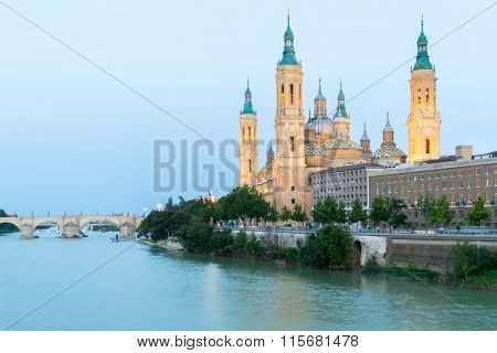 Our Lady of the Pillar Basilica with Ebro River at dusk Zaragoza, Spain