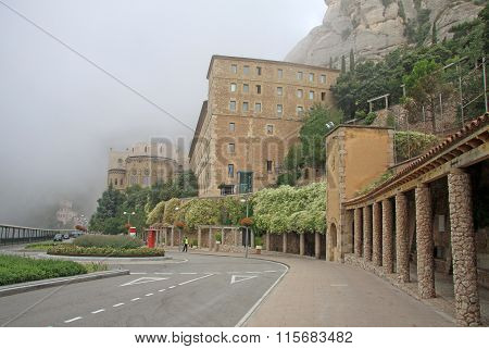 Montserrat, Spain - August 28, 2012: Misty Morning In The Benedictine Abbey Santa Maria De Montserra