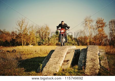 Enduro Racer Sitting On His Motorcycle