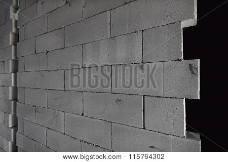 Raw AAC autoclaved aerated concrete wall, angle view, editable background.
