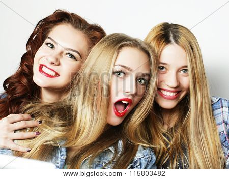 Three stylish sexy hipster girls best friends.