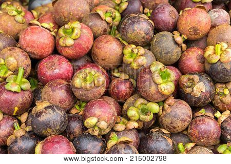 Fresh mangosteen in the basket on Thai market.