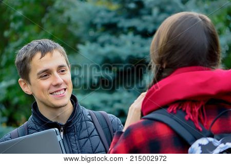 Two College Students Talking And Flirting