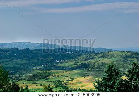 scenic view of green hills covered in grass and vegetation