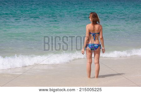 Young girl in the blue sea at PhuketThailand