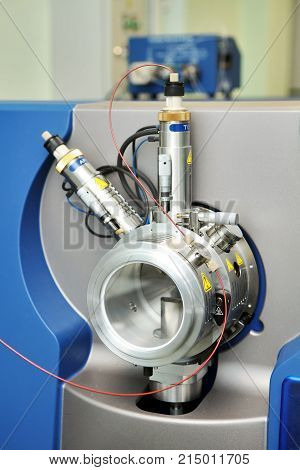 Adjust The Mass Spectrometer. The Man Analyzes The Device For Determining The Masses Of Atoms. Devic