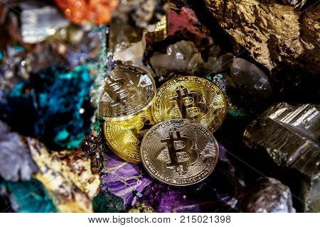 Silver and golden bitcoin in a cave of precious stones. Bitcoin cryptocurrency.