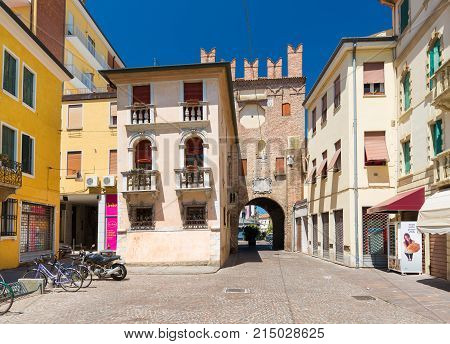 Rovigo - July 2017, Italy: Residential houses and the old tower made of red brick, historic center of Rovigo
