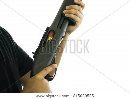 Man is holding a shotgun isolated on white