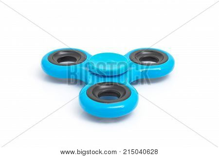 Blue spinner stress relieving toy isolated on white background