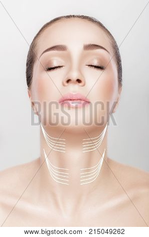 woman with arrows on her neck. lifting concept. correction of double chin