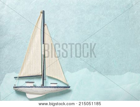 Sailing Yacht on light blue paper background