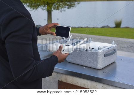Drone equipment near a lake and the drone box delivered package