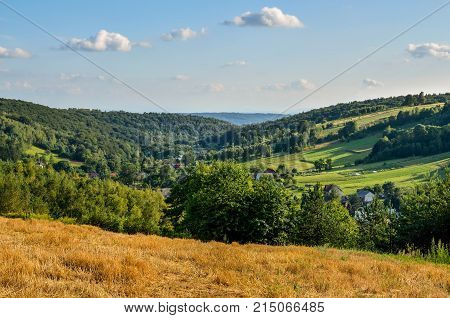 Rural summer landscape. A village in a beautiful Jurassic valley in Poland.