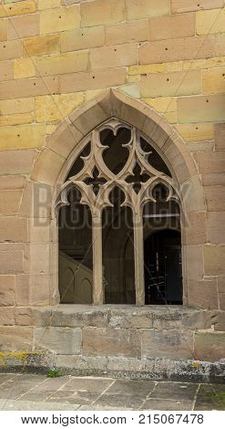 MAULBRONN, GERMANY -19, okt. 2017: couple sitting at gotic style houses window at the monastery courtyard in Maulbronn.