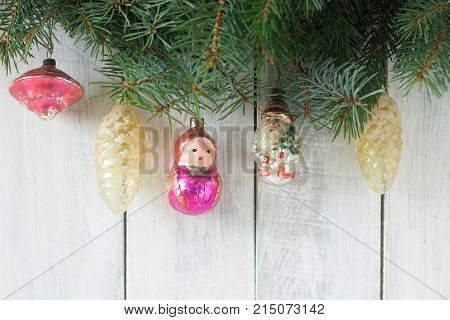 Christmas Or New Year's Background With Fir Branches And Old Christmas-tree Toys On A White Backgrou