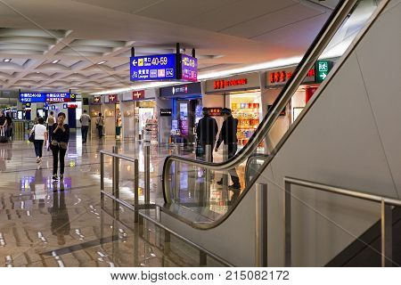 CHEK LAP KOK, HONG KONG - OCT 19, 2017: Passengers make their way towards their departure gate in Chek Lap Kok airport
