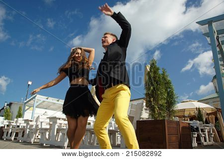 Couple Of Dancers Dancing Bachata On A City Street