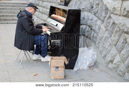 A pianist in the center plays the piano. Kiev. Ukraine. 2017.10.07