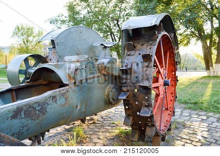 old spiked red iron wheel from the tractor