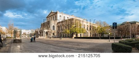 HANNOVER GERMANY - NOVEMBER 23 2017: Unidentified pedestrants cross the ganrd place in front of the opera house.