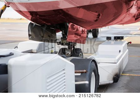 Towing Machine And Airplane On Runway
