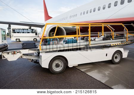 Luggage On Conveyor Belt Being Unloaded