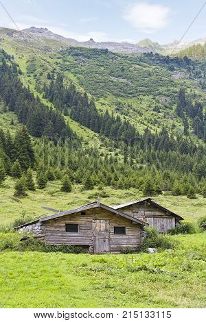 Tow big huts in the meadow of the valley of Galtuer one of the biggest skiing domain Austria