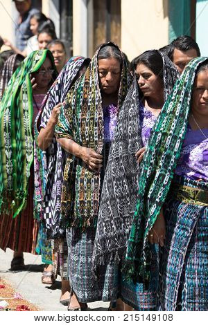 March 25,2016 San Pedro la Laguna, Guatemala: tzutujil mayan women walking in traditional dress during Easter Week celebration