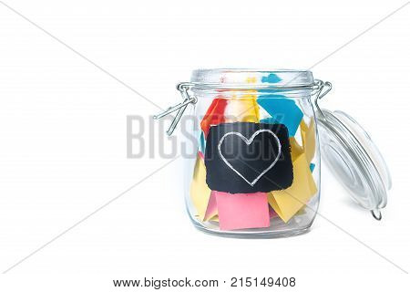 Open Bank with colorful stickers on a white background with white chalk-drawn heart