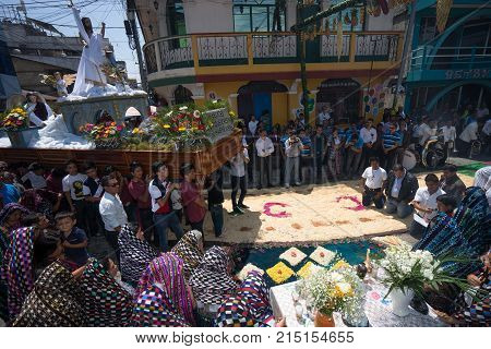 March 27, 2016 San Pedro la Laguna, Guatemala: a float is being carried through the street of the Mayan town during Easter procession