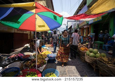 April 17, 2016 San Pedro la Laguna, Guatemala: Saturdays the main street of the indigenous town fills up with vendors and buyers during the weekly farmers market