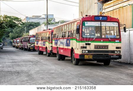 BANGKOK THAILAND - NOVEMBER 14: Rundown free fare buses by Bangkok Mass Transit Authority lined up in the morning before daily operation in Bangkok on November 14 2017.