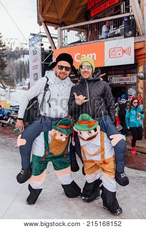 Sheregesh, Kemerovo region, Russia - April 22, 2017: Grelka Fest is a sports and entertainment activity for ski and snowboard riders in carnival costume. Young people in carnival costumes.