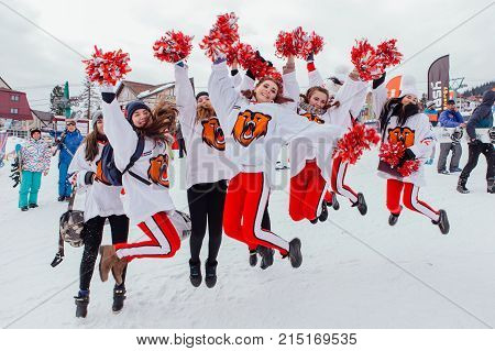 Sheregesh, Kemerovo region, Russia - April 22, 2017: Grelka Fest is a sports and entertainment activity for ski and snowboard riders in carnival costume. Group of young happy cheerleaders.