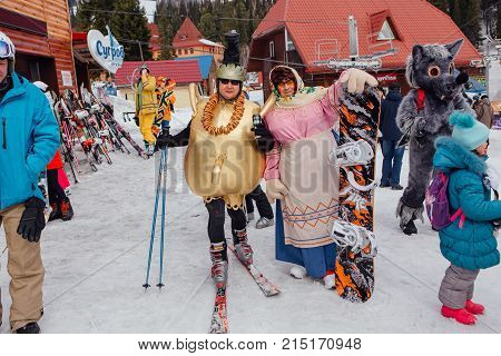 Sheregesh, Kemerovo region, Russia - April 22, 2017: Grelka Fest is a sports and entertainment activity for ski and snowboard riders in carnival costume. Young people in carnival costumes.