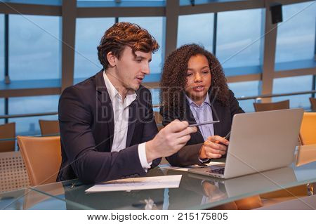 Business people having meeting around table in modern office.