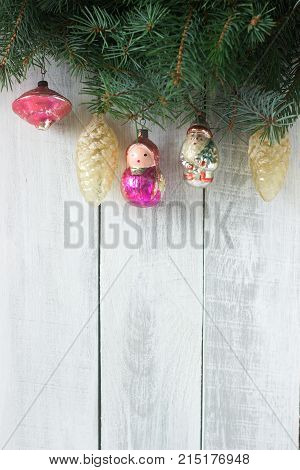 Christmas Or New Year's Background With Fir Branches And Old Christmas-tree Toys On A White Backgrou