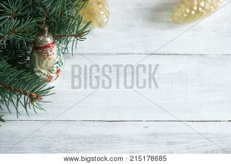 Christmas Or New Year's Background With Fir Branches And Old Christmas-tree Toys On A White Backgrou