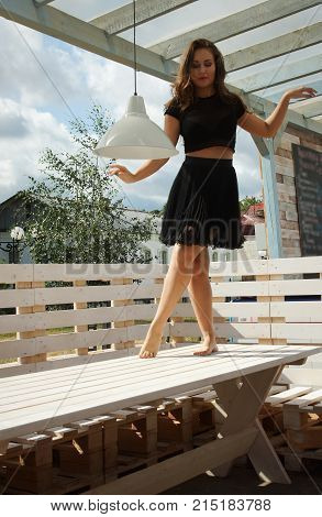 Beautiful dancer dancing bachata on a city street
