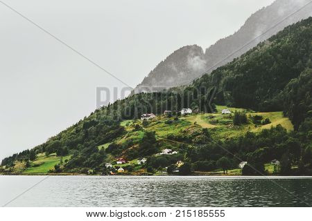 Foggy Forest Mountains and fjord village Landscape in Norway Travel scandinavian scenery moody weather