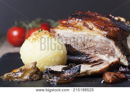 closeup of bavarian roasted pork with dumpling