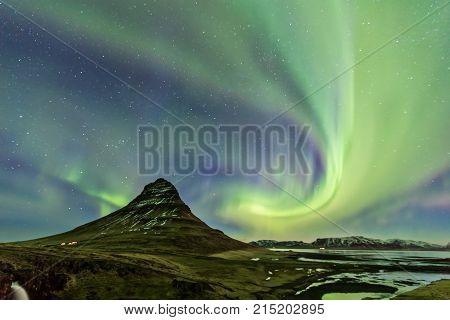 Northern Light Aurora Borealis At Kirkjufell Iceland With Fully Start In The Sky