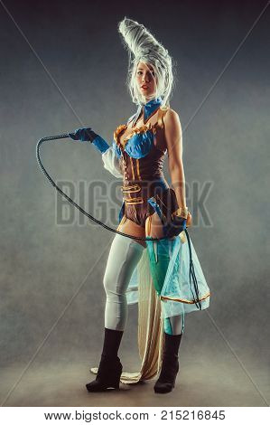 Beautiful Woman Trainer With The Whip In A Sexy Circus Suit
